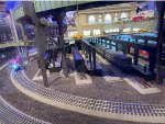 A model trolley car passing underneath model GCT